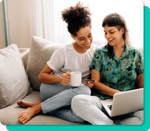2 woman looking at phone 2 woman looking at phone