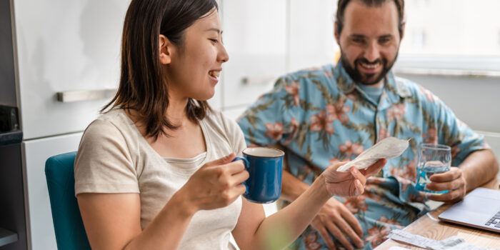 Newly married couple planning their home budget Newly married couple planning their home budget