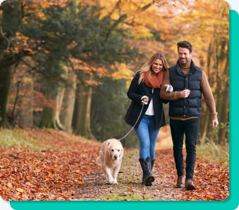 man and woman walking dog man and woman walking dog