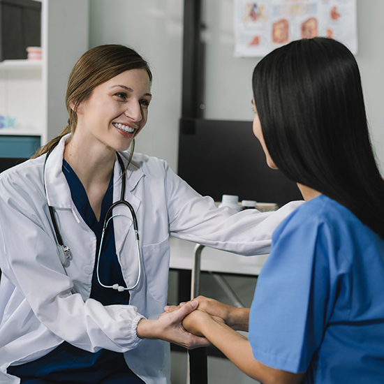 doctor talking with woman patient for monitoring and check up after surgery. doctor touching patient hand and consoling.