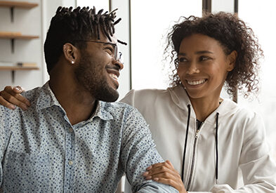 Smiling couple Smiling couple sitting at desk