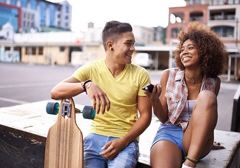 young-people Young people, laughing with one another while sitting down